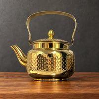 Gold Lily Style C teapot with a hammered body, metal swing handle and pointed lid finial