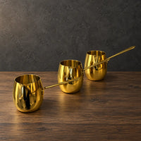 Gold drum-shaped stainless steel milk cups with matching metal handles