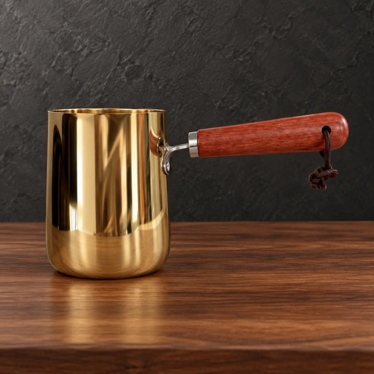 Gold stainless steel milk cups with natural wooden handles and lids
