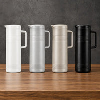 One-liter iron-shell thermos bottles in minimalist neutral finishes with fitted lids and side handles