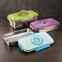 Three rectangular stainless steel food storage containers with green, purple, and light-blue latching lids, one shown open