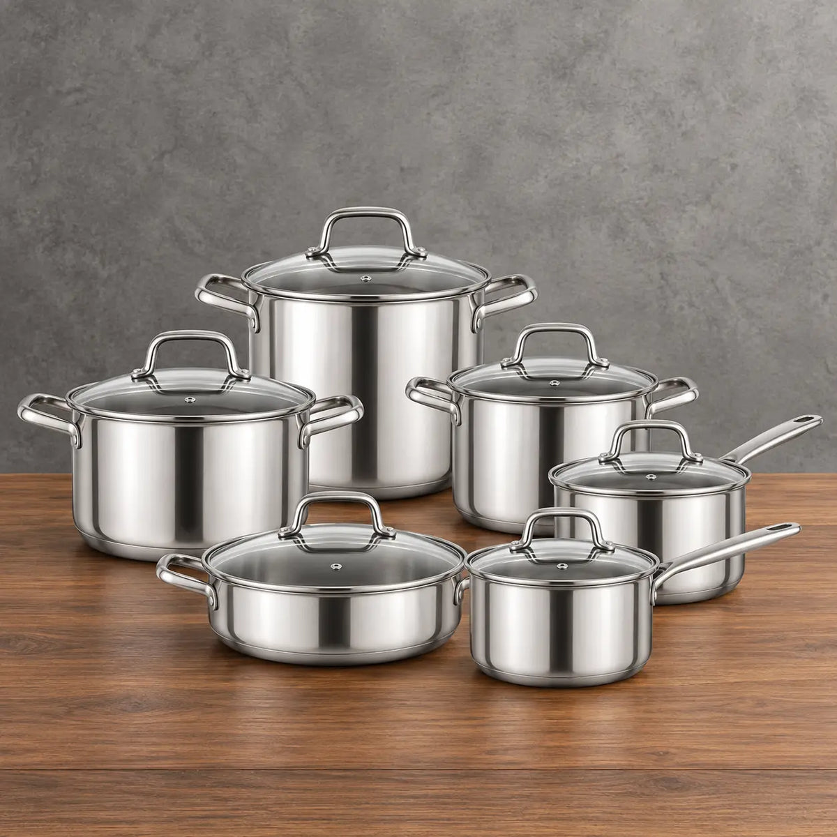 polished 201 stainless steel cookware set with glass lids and six vessels