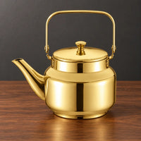 Gold Qingquan kettle with a squared metal swing handle, flat lid and left-facing spout