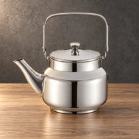 Silver Qingquan kettle with a squared metal swing handle, flat lid and left-facing spout