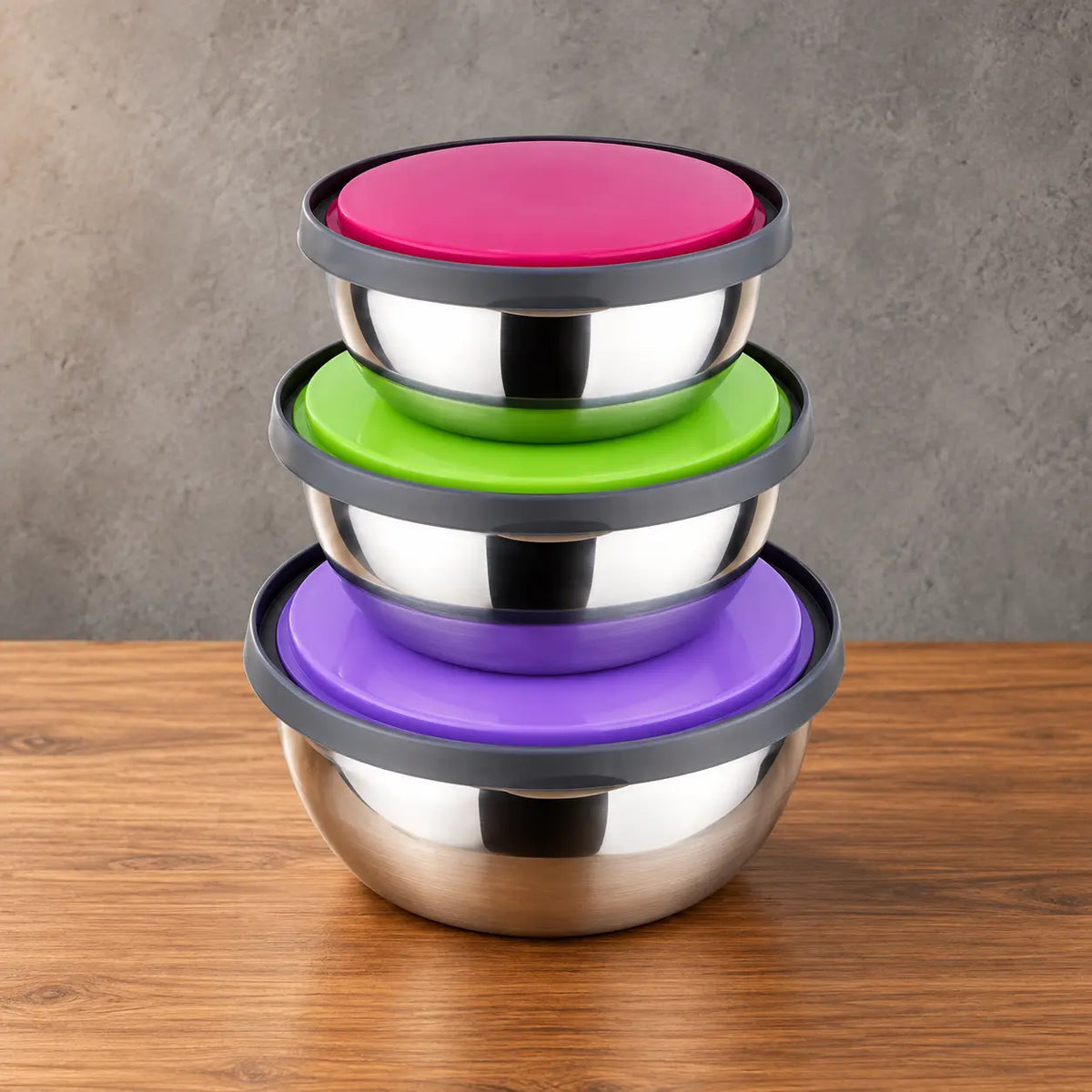 Round stainless steel food storage containers stacked with multicolor lids