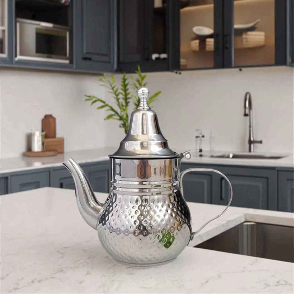 Mirror-polished Moroccan stainless steel teapot with a long pouring spout and built-in infuser for hospitality tea service